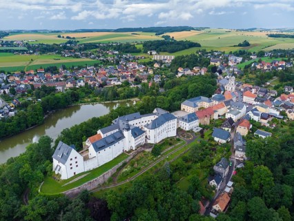 Wildenfels Castle rises on a mountain spur above the town of Wildenfels near Zwickau in Saxony. It