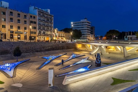 Modern architecture and colourfully lit fountains of Eleftheria Square at dusk, Nicosia, Cyprus,