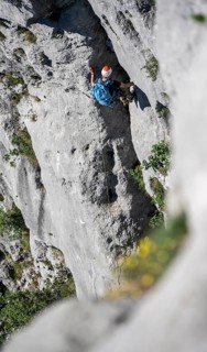 Climber on the rope, multi-pitch climbing, Via la Bellezza della Venere climbing tour, Garda