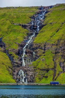 Waterfall tumbling down the hill, Streymoy, Faroe islands, Denmark, Europe