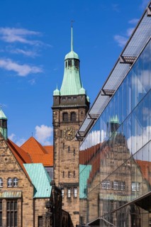 View through Bretgasse to the town hall with the reflection in Galeria Kaufhof