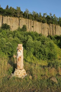 Organ pipes with basalt columns and wooden sculpture, wooden figure, chainsaw art, woodcarving,