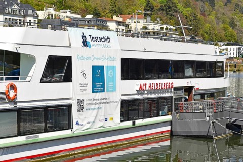 Heidelberg, Germany, April 2021: Corona virus test station called 'Testschiff' on boat offering