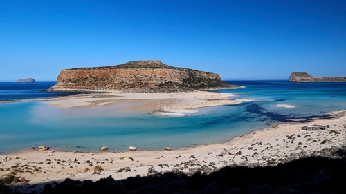 Rocky island with shallow water and sandbank, peaceful and quiet natural scenery, Gramvoussa,