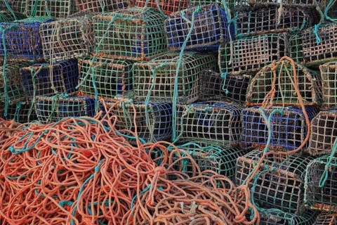 Lobster cages, lobster pots, here in Portugal, Algarve, Stacked fishing nets and ropes in different
