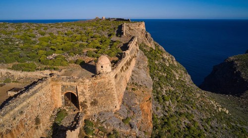 Drone shot, Part of a historic fortress on a cliff overlooking the Blue Clipper, Venetian sea