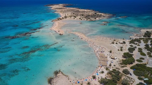 Overtourism, Tourists on the beach, Sunshades, A beach with turquoise waters, ideal for a relaxing