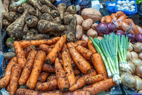 Carrots, parsnips and other vegetables for sale at a market