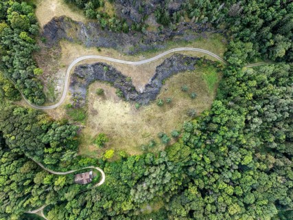 Aerial photograph, top view, top down view of the former basalt quarry at the foot of the