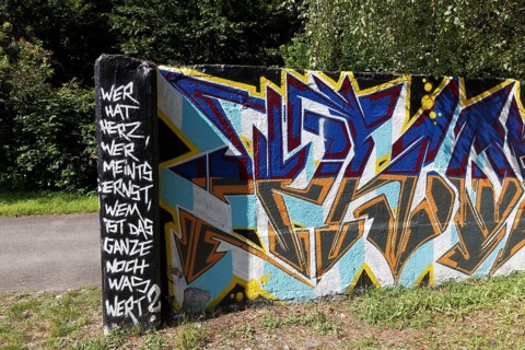 Graffiti with moral text, compassion, truthfulness and appreciation, Landschaftspark Duisburg
