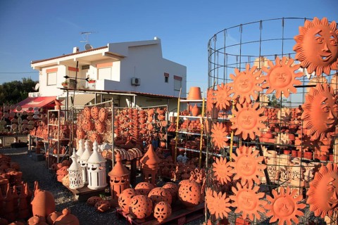 Pottery at Cacela Vehla, Algarve, Portugal, An outdoor area of a shop with lots of terracotta
