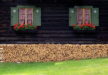 Log cabin with flower boxes, geraniums, shutters, stock of firewood, logs, romantic, Vigiljoch,