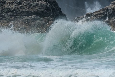 Large waves of the Atlantic Ocean crash against the rocks of a cliff. Camaret sur mer, Crozon,