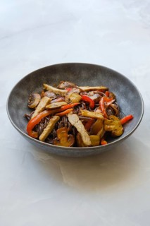 Stir fried pork meat with mushrooms and black rice noodles