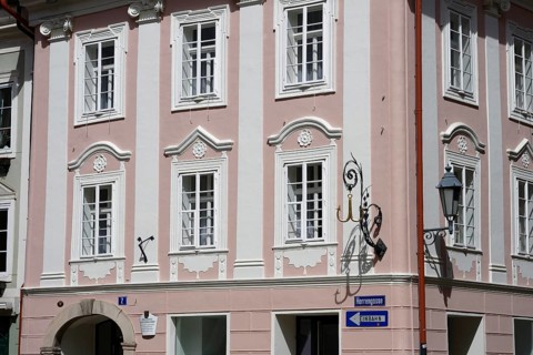 Historic building with pink façade and white shutters, Herrengasse 2, Innere Stadt, Klagenfurt,