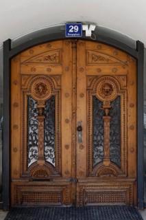 Decorative antique wooden door with ornate carvings, main square 29, Villach, Carinthia, Austria,