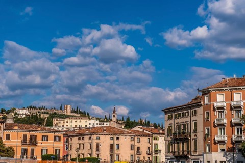 View of Verona historical city centre, Ponte Pietra bridge across Adige river, Verona Cathedral,