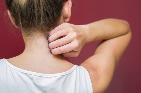 Great concept of allergy and skin diseases, young woman scratching herself