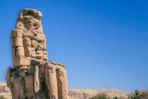 Behold the awe-inspiring Colossi of Memnon as they stand proudly in the soft morning light. These