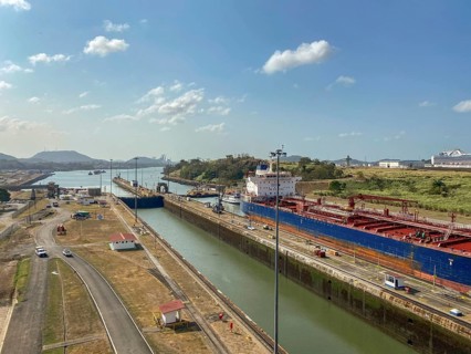 Wide waterway of the Panama Canal with a large ship in a vast landscape, panama city, panamakanl,