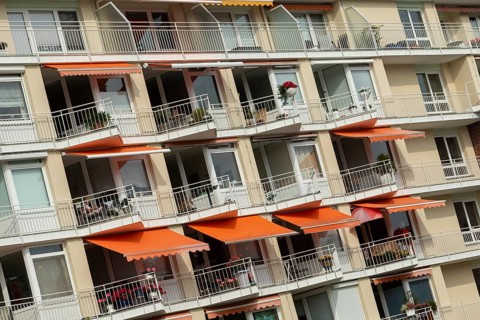 Façade with balconies and awnings of the Rosenhof retirement home on Priwall, Travemünde seaside