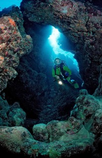 Diver in underwater cave, Egypt, Zabargad, Zabarghad, Red Sea, Africa