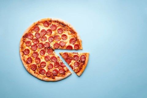 Pepperoni pizza on a blue background top view. Traditional italian food. Flatlay with a home-baked