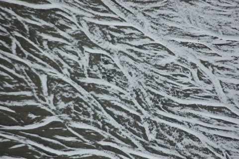 Pattern of snow in braided river bed near Lake Coleridge, Canterbury, New Zealand, Oceania