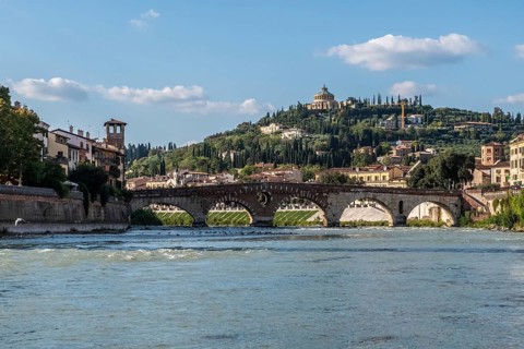 View of Verona historical city centre, Ponte Pietra bridge across Adige river, Verona Cathedral,