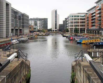Leeds, west yorkshire, united kingdom, 4 july 2019: a view of leeds dock from the lock gates with