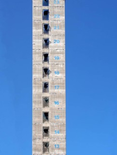 A tall concrete structure and service core of a new skyscraper building under construction with