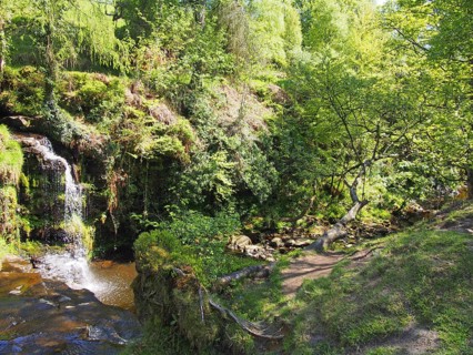 Lumb hole falls a waterfall in woodland at crimsworth dean near pecket well in calderdale west