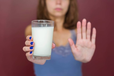 Great concept of food allergy, allergy to milk, lactose, bad woman with milk