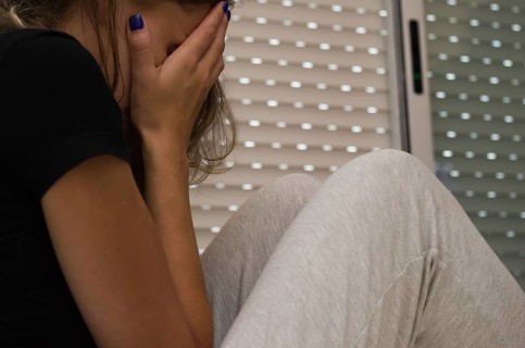 Great concept of depression, sad woman in bed