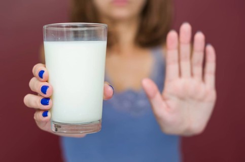 Great concept of food allergy, allergy to milk, lactose, bad woman with milk