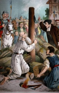 Catholic priest calling on anabaptist to recant at the stake