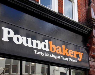 Leeds, west yorkshire, united kingdom, 7 july 2021: sign and slogan above the entrance of the pound