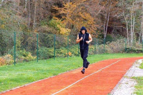 Young man jogging in the morning outdoor on the running race track
