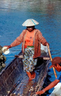 Indonesian woman in fishing boat, Indonesia, Sulawesi, Celebes, fishing village Lamanggau, Asia