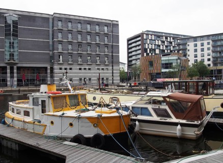 Leeds, west yorkshire, united kingdom, 1 july 2019: boats moored on the jetty at leeds dock with