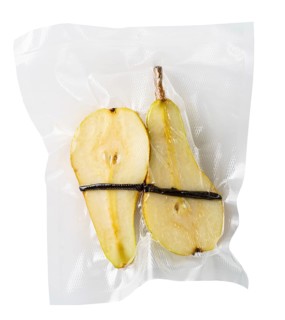 Vacuum sealed fresh pears with vanilla for sous vide cooking cutout on white