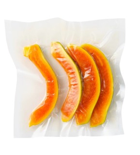 Vacuum sealed fresh papaya for sous vide cooking on white background cutout on white