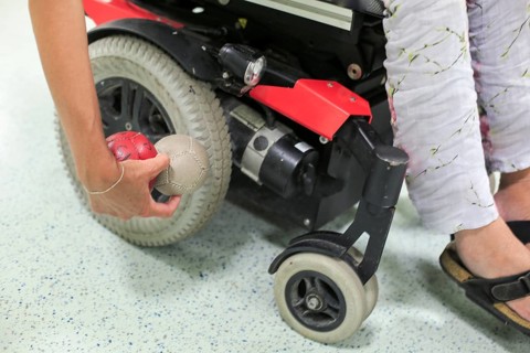 Disabled Boccia player training on a wheelchair