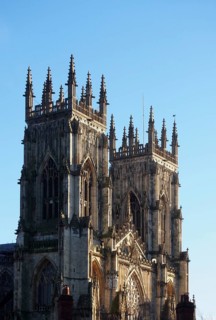 A view of the towers at the front of york minster in sunlight