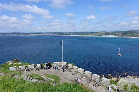 View of coast from fortress with cannon, St Michaels Mount, Marazion, England, UK