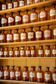 Enkhuizen, Netherlands, June 2022. Shelves with glass jars containing ingredients for medicine.