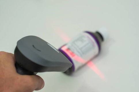 Great concept of traceability, ERP system, hand crawling product barcode and packaging. The man