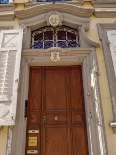 Old wooden door with decorative sign and lettering in a historic architectural style, Weissenburg,