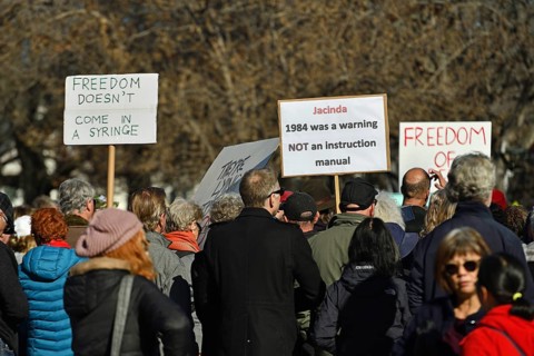CHRISTCHURCH, NEW ZEALAND, JULY 24, 2021, People at a protest rally at the Bridge of Remembrance in
