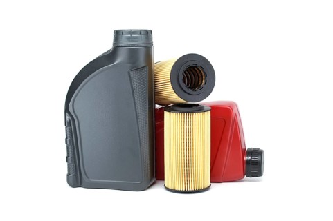 Motor oil filters elements oil and containers isolated on a white background. Car servicing,
